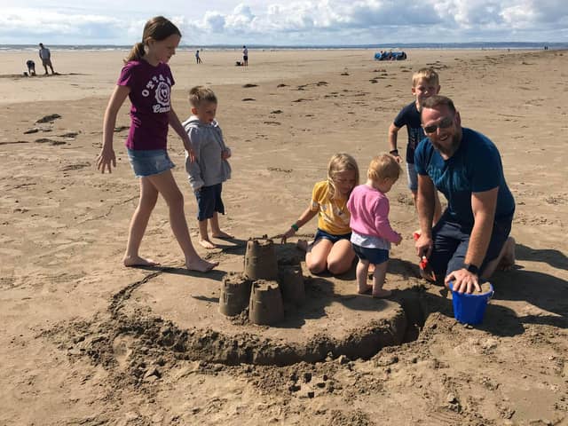 Royal Navy chief petty officer Keith Ross with his five children. CPO Ross died in a car crash on the M275 on July 15.