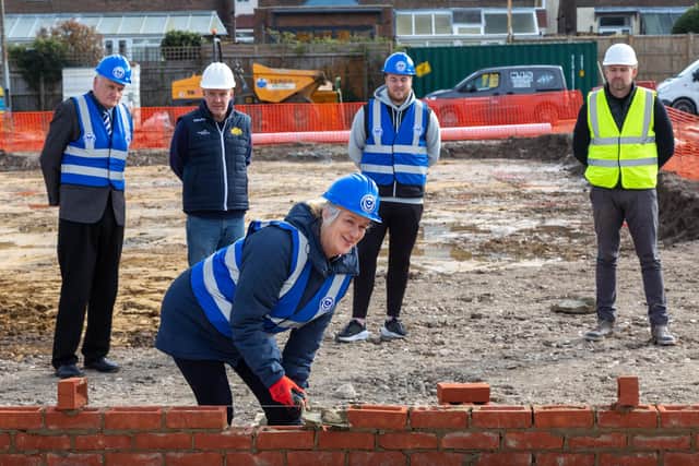 Clare Martin, CEO of Pompey in the Community, laying the foundations of the new John Jenkins Stadium at Moneyfields. Also pictured (from left) Eric Coleborn (Pompey Women chairman), Pete Seiden (Moneyfields chairman), Jay Sadler (Pompey Women manager) and Martin Talman (site manager). Picture: Mike Cooter