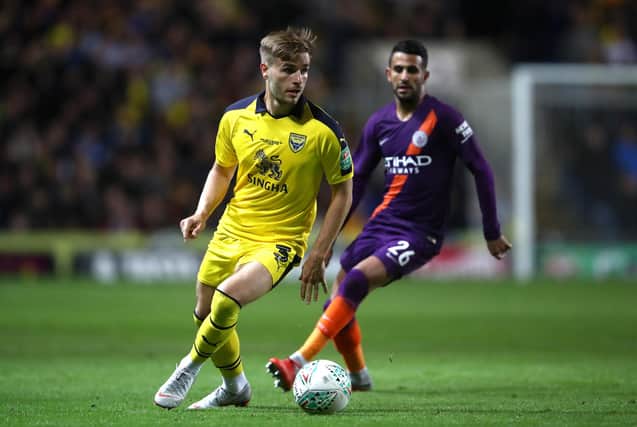 OXFORD, ENGLAND - SEPTEMBER 25: Luke Garbutt of Oxford United is put under pressure from Riyad Mahrez of Manchester City during the Carabao Cup Third Round match between Oxford United and Manchester City at Kassam Stadium on September 25, 2018 in Oxford, England.  (Photo by Julian Finney/Getty Images)
