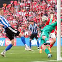 Harry Isted thwarts Sheffield Wednesday's Michael Smith in the League One play-off final at Wembley. Picture: Catherine Ivill/Getty Images