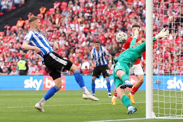 Harry Isted thwarts Sheffield Wednesday's Michael Smith in the League One play-off final at Wembley. Picture: Catherine Ivill/Getty Images