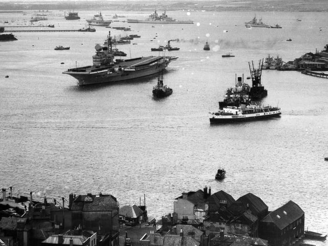 HMS Victorious leaving Portsmouth Harbour in 1958. Above her is the battleship HMS Vanguard. (Robin Kay collection)