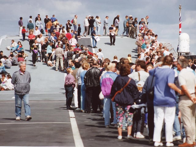 Visitors line up along the platform to disembark from HMS Ark Royal.
Picture: (2259-6)