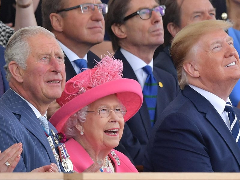 (L-R) Britain's Prince Charles, Prince of Wales, Britain's Queen Elizabeth II and US President Donald Trump look up as aircraft perform a fly-over during an event to commemorate the 75th anniversary of the D-Day landings, in Portsmouth, southern England, on June 5, 2019. - US President Donald Trump, Queen Elizabeth II and 300 veterans are to gather on the south coast of England on Wednesday for a poignant ceremony marking the 75th anniversary of D-Day. Other world leaders will join them in Portsmouth for Britain's national event to commemorate the Allied invasion of the Normandy beaches in France -- one of the turning points of World War II. (Photo by Daniel LEAL-OLIVAS / AFP) (Photo credit should read DANIEL LEAL-OLIVAS/AFP/Getty Images)
