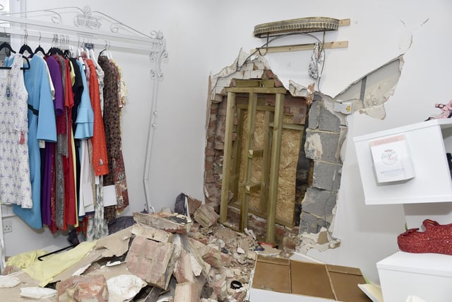 Damage to Voluptuous Vintage shop and a residential property next door in Village Road, Alverstoke, where a two-car collision took place and three people have been arrested. Picture: Sarah Standing