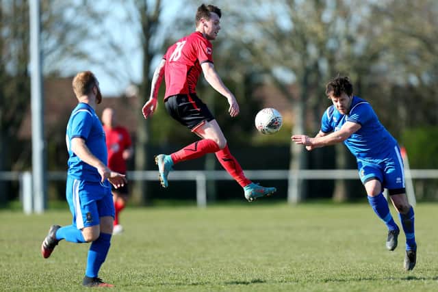 Connor Hilton, left, Locks Heath v Fleetlands (blue).
Picture: Chris Moorhouse