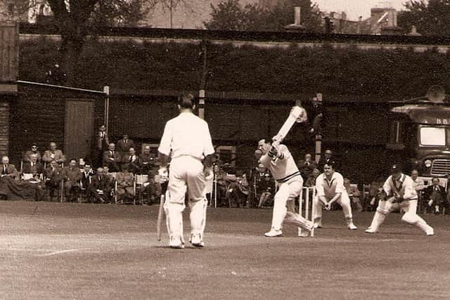 Roy Marshall in action for Hampshire at Portsmouth with an antiquated BBC radio van in the background