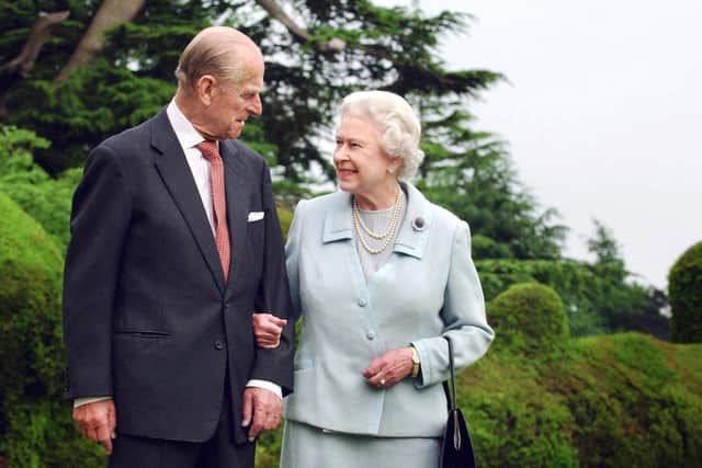 Queen Elizabeth II and her husband, the Duke of Edinburgh walk at Broadlands, Hampshire, earlier in the year. - Queen Elizabeth II and Prince Philip are to mark their diamond wedding anniversary in reserved style 19 November 2007 before jetting off to Malta to revive golden memories of their newlywed youth. FIONA HANSON/POOL/AFP via Getty Images.