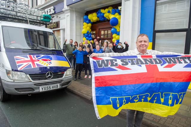 Bluewater care home owner, David Sheppard, drove a van full of supplies to Ukraine. Pictured: David Sheppard holding a flag, the Lord Mayor, Frank Jonas and his sister, the mayoress, Joy Maddox, care home staff, Radio Victory DJs, and staff of George and Dragon outside Bluewater care home, Portsmouth, on Friday April 8, 2022. Picture: Habibur Rahman.