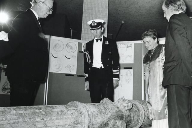 Prince Charles, president of the Mary Rose Trust, inspecting a cannon with Archaeological Director Margaret Rule during a private preview of an exhibition being staged by the trust in the Mountbatten Gallery.