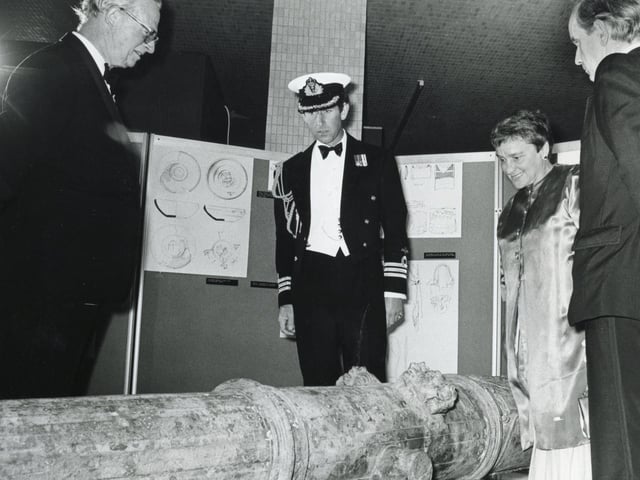 Prince Charles, president of the Mary Rose Trust, inspecting a cannon with Archaeological Director Margaret Rule during a private preview of an exhibition being staged by the trust in the Mountbatten Gallery.