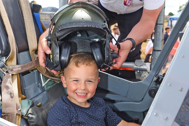 Ralf, 4,  in a harrier cockpit assisted by CPO AET Finn McCutcheon. Picture by PO Phot Pepe Hogan