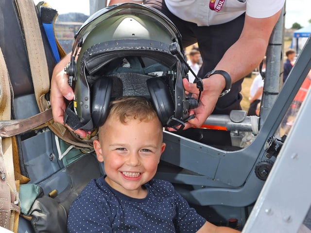 Ralf, 4,  in a harrier cockpit assisted by CPO AET Finn McCutcheon. Picture by PO Phot Pepe Hogan