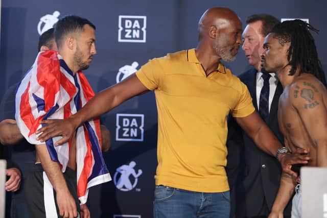 Boxing legend Bernard Hopkins separates Mikey McKinson and Alex Martin at yesterday's weigh-in.  Pic: Tom Hogan/Golden Boy