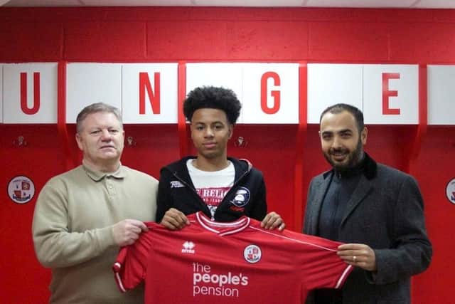 Gosport Borough loan signing Rafiq Khaleel, centre, with Crawley boss John Yems, left, and the League Two club's chief executive Erdem Konyar Picture: Crawley Town FC