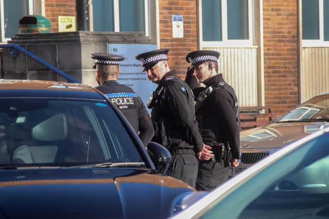 Police outside Portsmouth Magistrates' Court while defendants accused of violent disorder in Fred Francis Close were going before the court