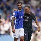 Skipper Marlon Pack and assistant head coach Jon Harley celebrate at the final whistle following Pompey's 3-1 victory over Peterborough. Picture: Jason Brown/ProSportsImages