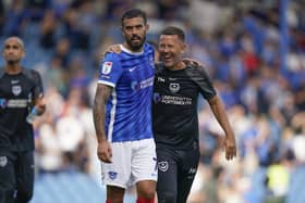 Skipper Marlon Pack and assistant head coach Jon Harley celebrate at the final whistle following Pompey's 3-1 victory over Peterborough. Picture: Jason Brown/ProSportsImages