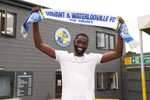 Mo Faal signs for the Hawks this week. Picture by Dave Haines