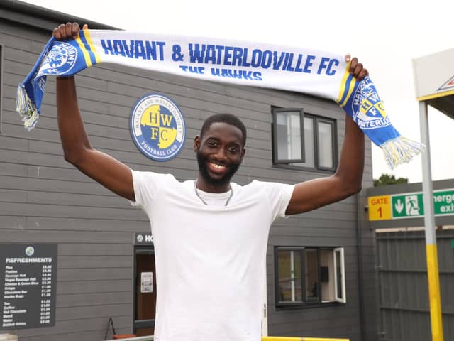 Mo Faal signs for the Hawks this week. Picture by Dave Haines
