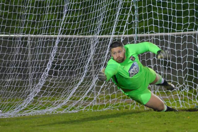 Fareham keeper Dane Rigby can't keep out Silvano Obeng's penalty. Picture: Martyn White