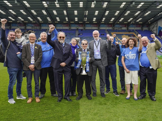 Members of the Portsmouth Supporters' Trust were welcomed onto the Fratton Park pitch to mark the 10-year anniversary of when since fans clubbed together to save the club from liquidation.