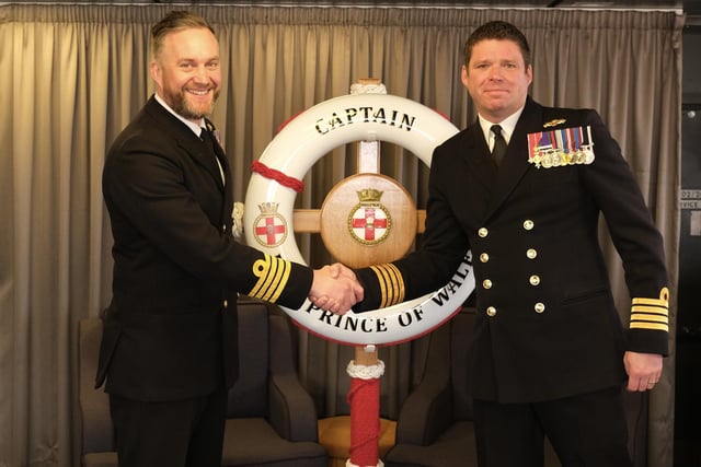 Captain Will Blackett became the new Commanding Officer of HMS Prince of Wales in the first week of January. Pictured is him shaking hands with former CO Captain Richard Hewitt OBE.