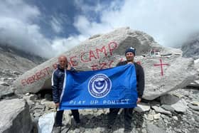 Pompey kitman Shaun North, left, and son Shane at Mount Everest Base Camp before they were left stranded on the mountain for five days