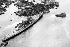 HMS Vanguard runs aground in Portsmouth Harbour after breaking loose but narrowly avoids the Still & West pub,  August 4, 1960. The News PP5335