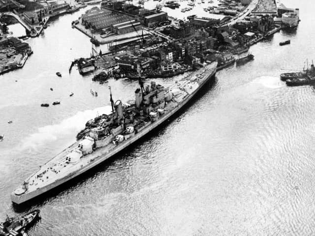 HMS Vanguard runs aground in Portsmouth Harbour after breaking loose but narrowly avoids the Still & West pub,  August 4, 1960. The News PP5335