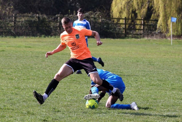Action from the Buster Gordon Memorial Cup tie between AC Copnor (blue and white kit) and Seagull (orange and black kit). Picture: Sam Stephenson