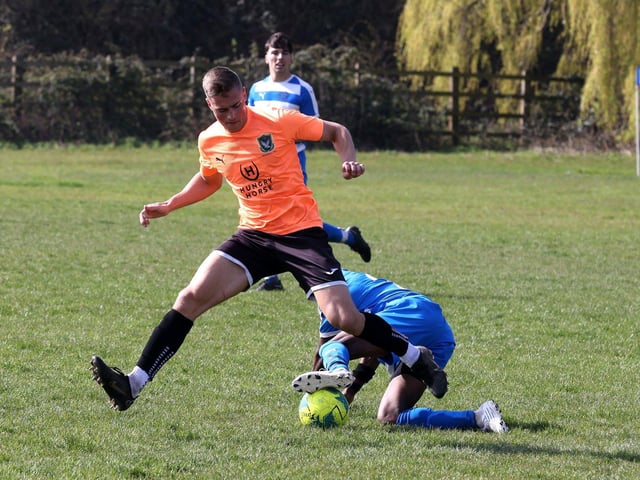 Action from the Buster Gordon Memorial Cup tie between AC Copnor (blue and white kit) and Seagull (orange and black kit). Picture: Sam Stephenson