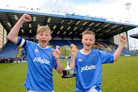Tommy Leigh, right, celebrates cup success at Fratton Park as a youngster. Picture: Ian Hargreaves  (131225-1)