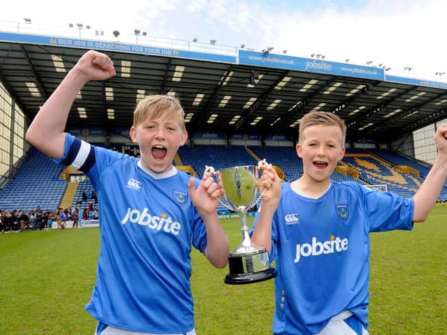 Tommy Leigh, right, celebrates cup success at Fratton Park as a youngster. Picture: Ian Hargreaves  (131225-1)