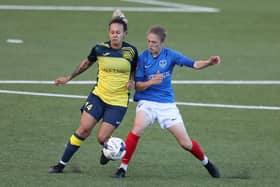 Sokhara Goodall, left, battles Pompey Women's Shannon Albuery for the ball. Picture: Dave Haines