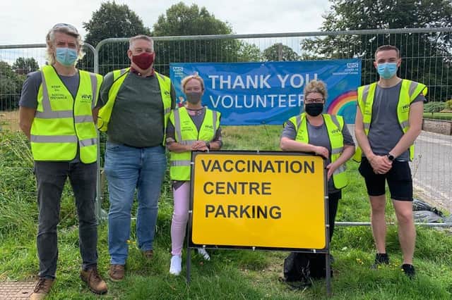 BAE Systems employees help out The Hive at the vaccination centre in St James' Hospital