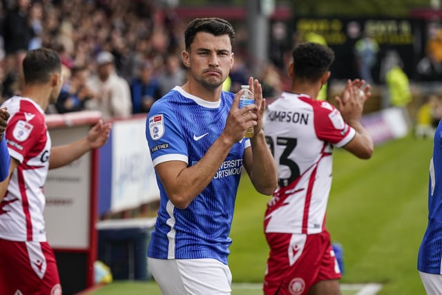 Regan Poole looks suitably impressed as he applauds the away end at the start of the game