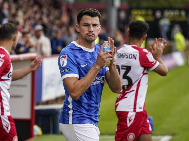 Regan Poole looks suitably impressed as he applauds the away end at the start of the game