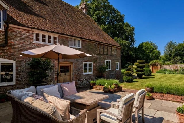 This property comes with seven bedrooms, four bathrooms and four reception rooms as well as grounds and a garden with a Dovecote.