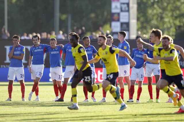 Pompey players distraught after they're knocked out of the League One play-offs on penalties to Oxford. Picture: Robin Jones/Getty Images