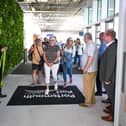 The first passengers enter through the new terminal