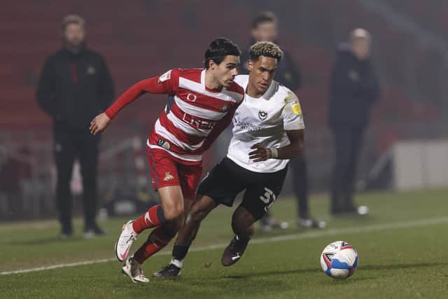 Haji Mnoga and Doncaster scorer Reece James (Photo by Daniel Chesterton/phcimages.com)