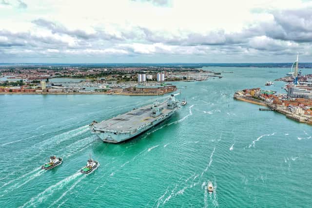 HMS Queen Elizabeth returning to Portsmouth in order to resupply for upcoming fighter jet trials. Picture: Mark Cox
