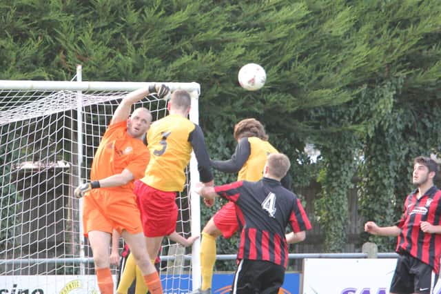 Goalkeeper Matt Shortt (orange) was among the scorers as Fleetlands romped to a 7-0 Hampshire Premier League win at Winchester Castle.