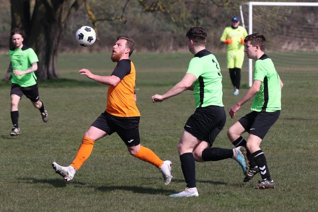 Action from the City of Portsmouth Sunday League Division Five match between AFC Farlington (orange shirts) and AFC Bedhampton Village A (light green shirts). Picture: Sam Stephenson