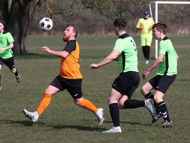 Action from the City of Portsmouth Sunday League Division Five match between AFC Farlington (orange shirts) and AFC Bedhampton Village A (light green shirts). Picture: Sam Stephenson
