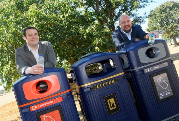 Portsmouth City Council is launching the second part of its 'Don't be a din, put it in the bin' campaign unveiling new recycling bins around Southsea Common.

Pictured is: (l-r) Councillors Dave Ashmore, cabinet member for environment and climate change and Steve Pitt, deputy leader of Portsmouth City Council with the new recycling bins.

Picture: Sarah Standing (060820-2040)