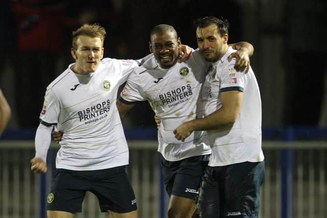 Perry Ryan, Dennis Oli and Ed Harris celebrate a goal during Hawks' 4-1 FA Trophy win over higher division Aldershot in 2014. Pic: Dave Haines.
