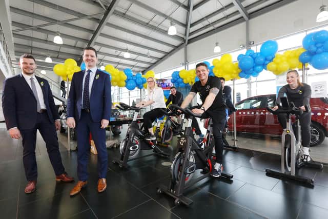 Richmond Motorgroup, in Farlington, held a sponsored static bike ride with all donations going to Ukraine via the Disasters Emergency Committee appeal. The cyclists are pictured with dealer principal Charlie Bishop, left, and head of marketing and communications Craig Williamson, second leftPicture: Chris Moorhouse (jpns 090322-04)