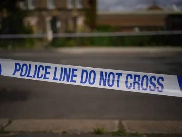 A female motorcyclist was left injured following a crash outside a fire station.